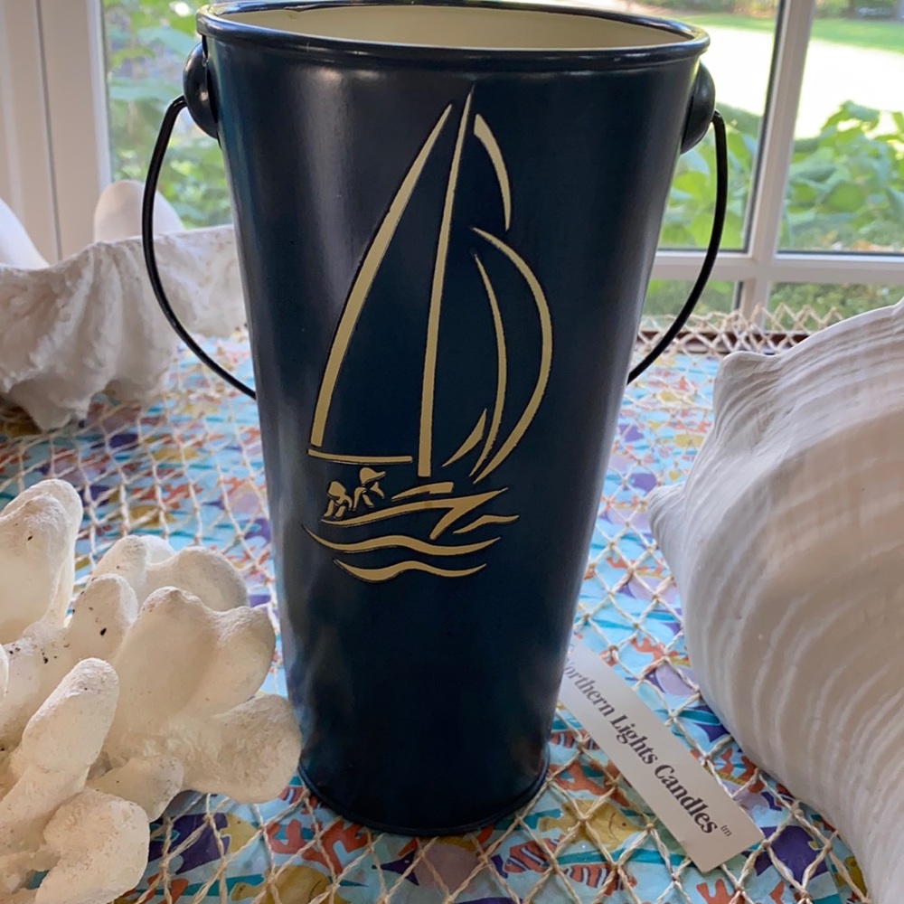 Metal bucket candle. Sailboat